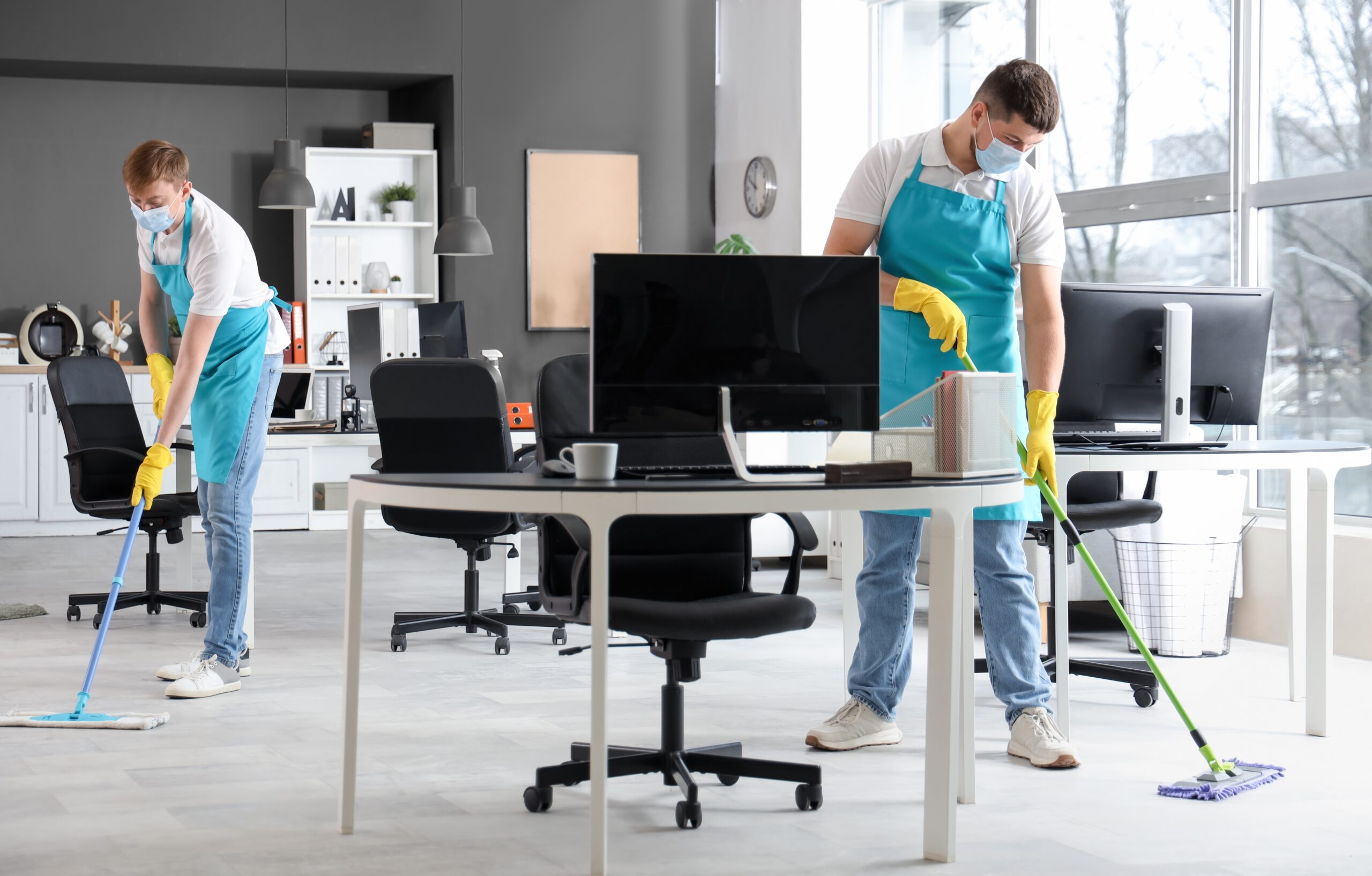 Two men cleaning mopping the floor office